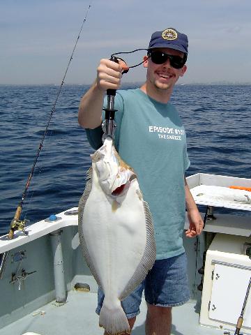 Saltwater fishing for
                      huge summer flounder!